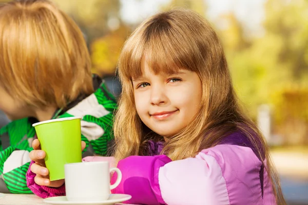 Blond girl with green cup — Stock Photo, Image