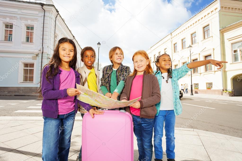 Kids with map and luggage