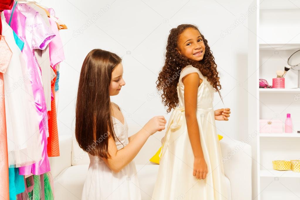 Girl helping to fit the dress