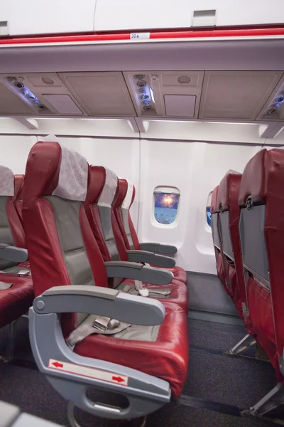 Row of red sits in airplane — Stock Photo, Image