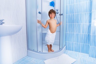 Little boy in hotel shower