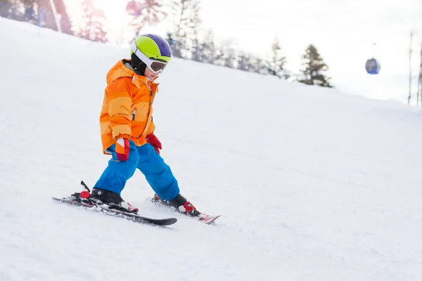 Skiing boy in ski mask on slope — Stock Photo, Image