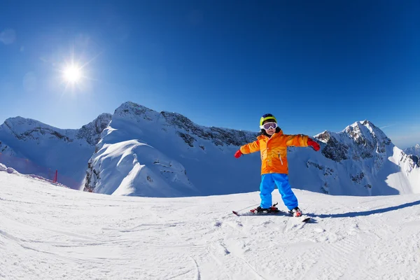 Happy boy in ski mask skiing — Stock Photo, Image