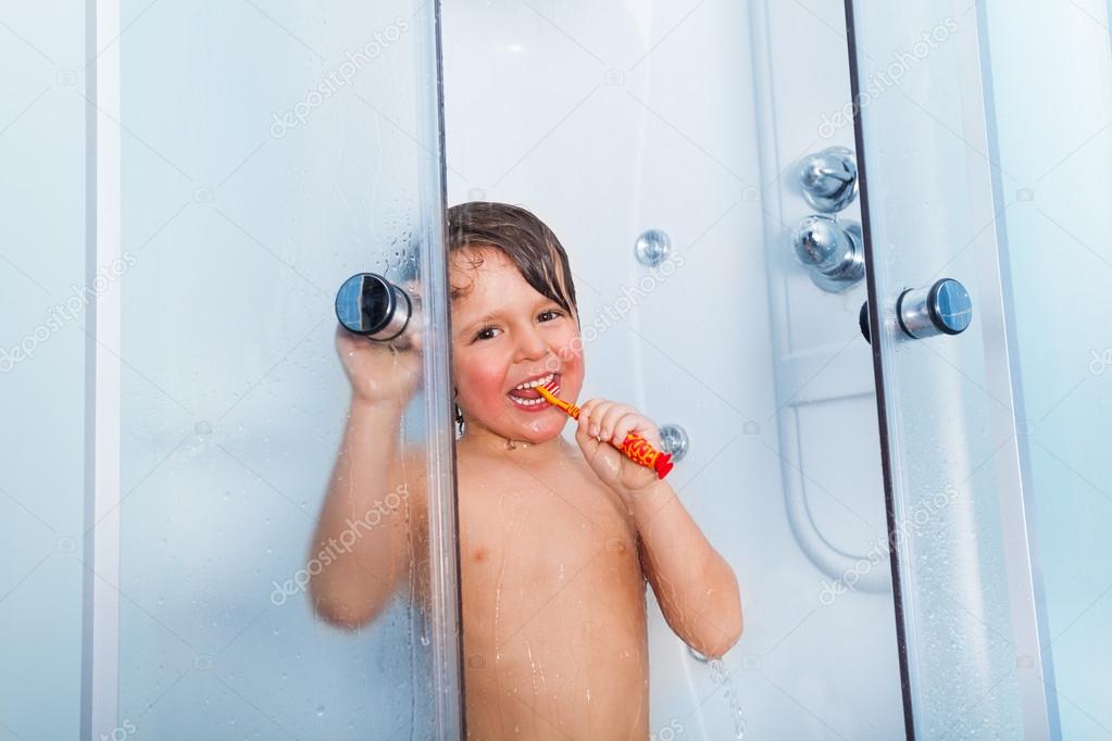 Boy brush teeth in shower