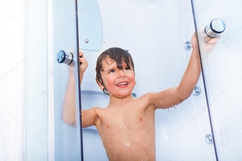 Boy taking shower in cabin