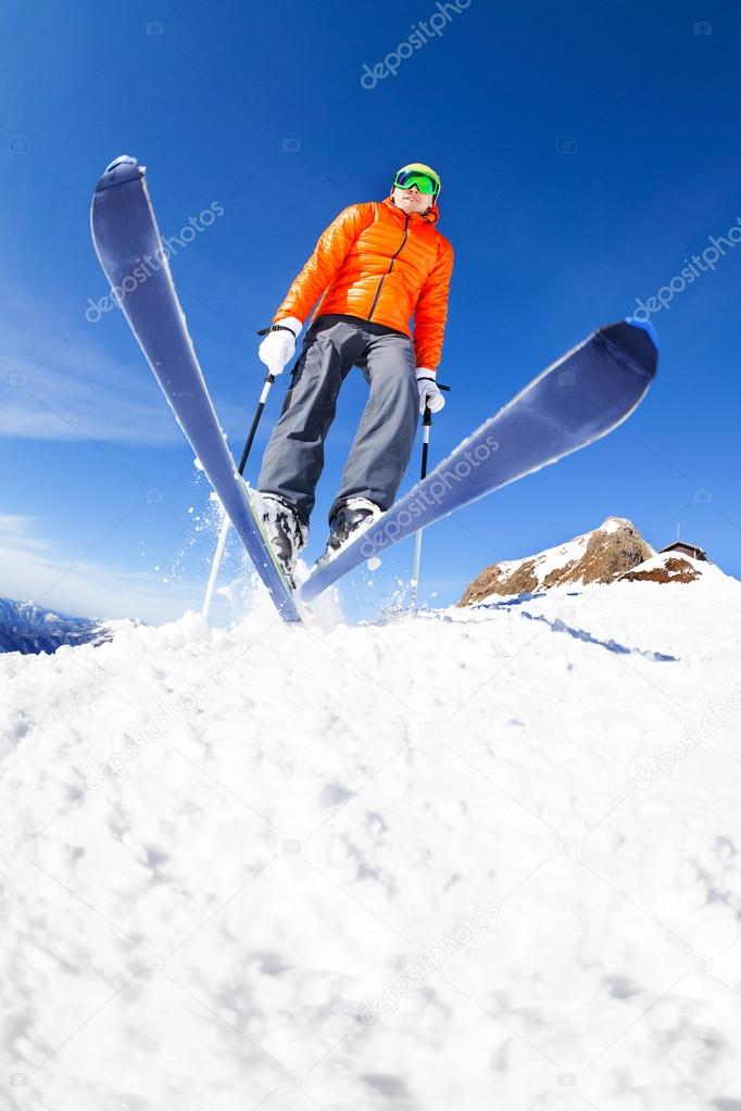 Skier jumping during winter day