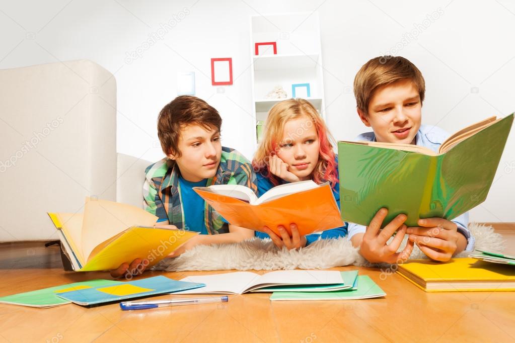 Three teen kids read books
