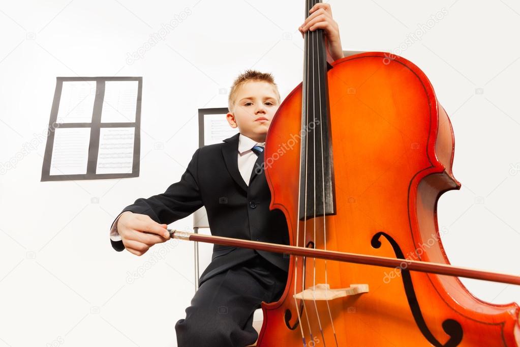 Boy playing violoncello