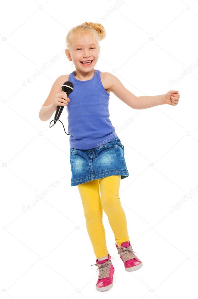 Cute small girl singing in microphone