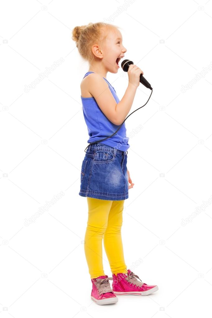 Small girl in colorful clothes singing