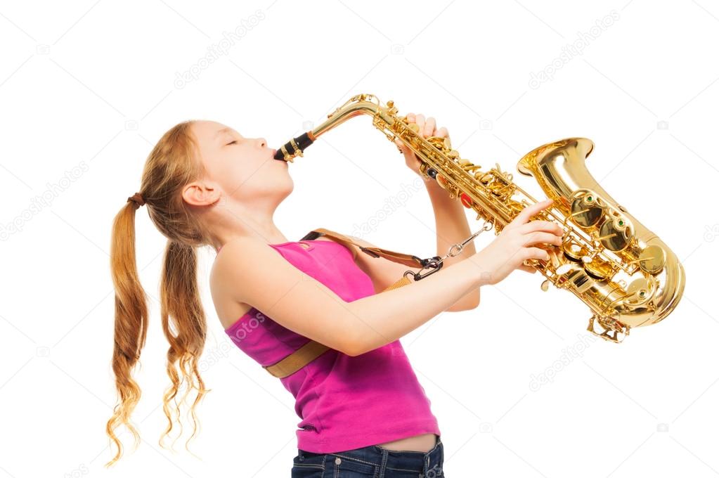Happy girl playing saxophone