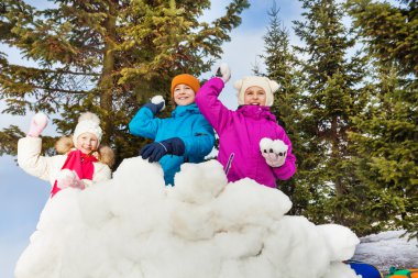 Group of kids play snowballs game