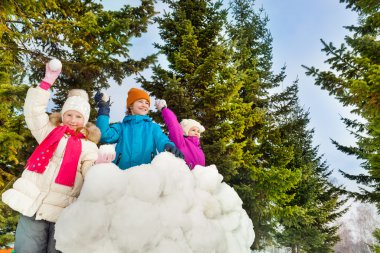Happy kids playing snowballs game