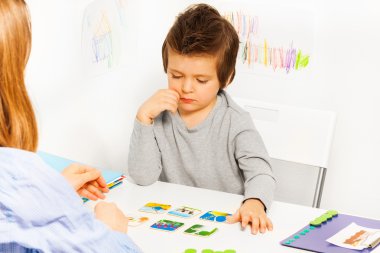Concentrated boy plays developing game