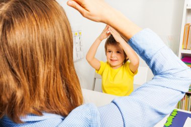 Boy putting hands together