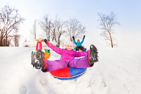 Girl and friends slide down — ストック写真