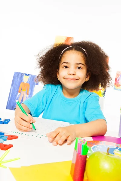 Cute African girl writing letters — Stock Photo, Image