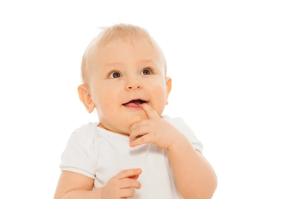 Bebê feliz com o dedo na boca — Fotografia de Stock