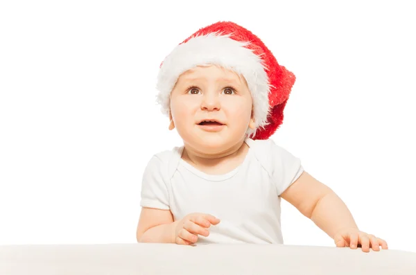 Baby i röda Xmas hatt — Stockfoto