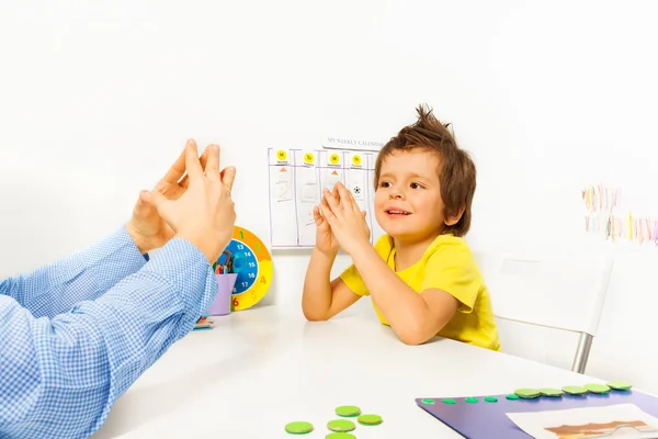 Boy exercises improving motor skills — Zdjęcie stockowe