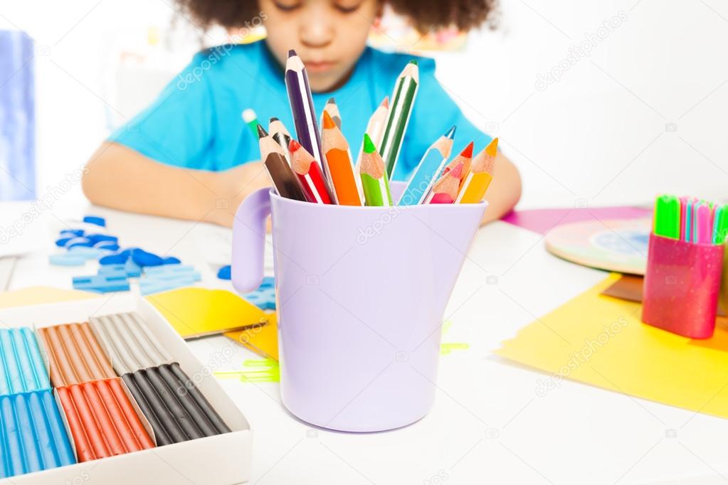 pencils and African girl writing