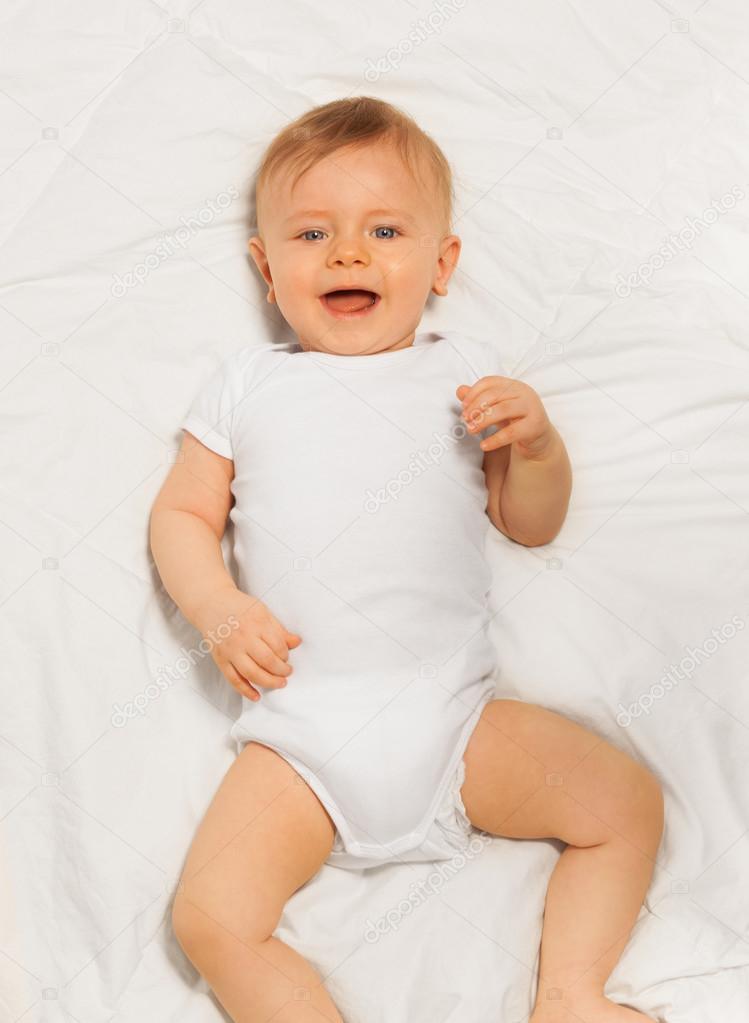Laughing small baby wearing bodysuit