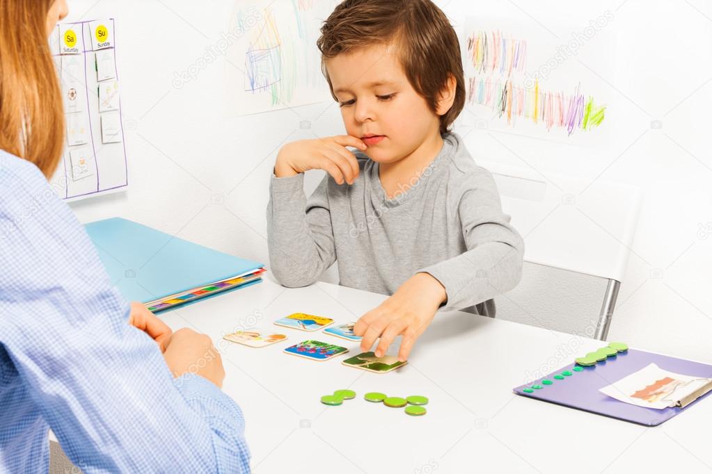 Preschooler boy plays in developing game