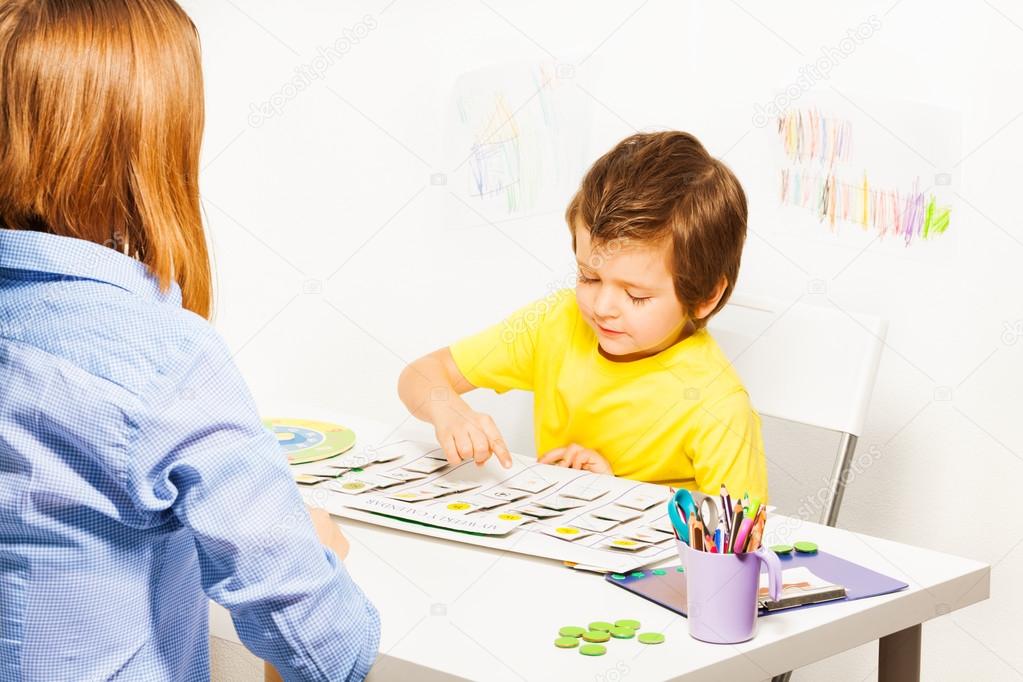 Boy plays in developing game pointing