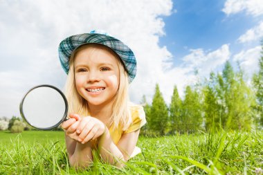 Small beautiful girl with magnifier clipart