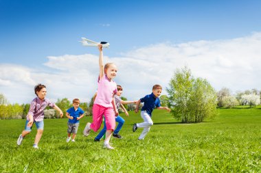 happy running kids with airplane toy