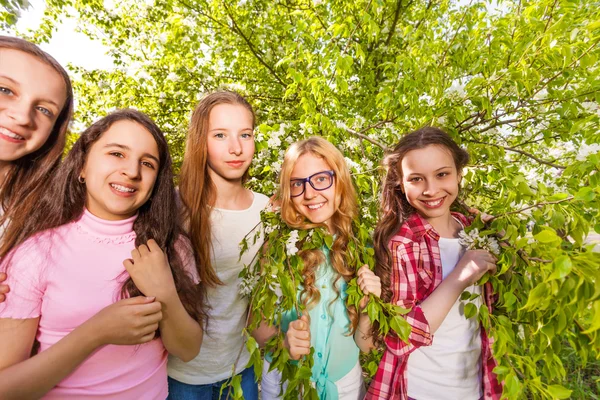 Charming teenage girls standing in forest — Stock Photo, Image