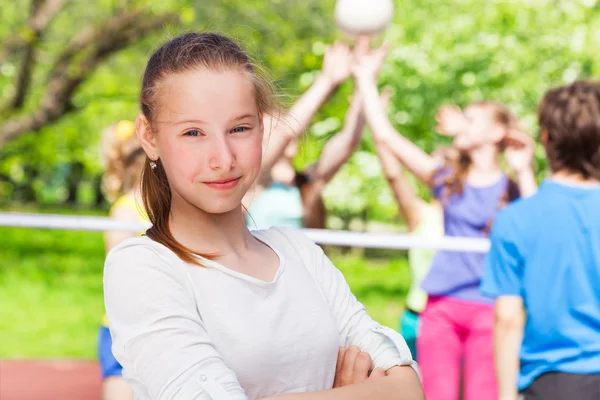 Teen girl with team playing volleyball — Stock Photo, Image