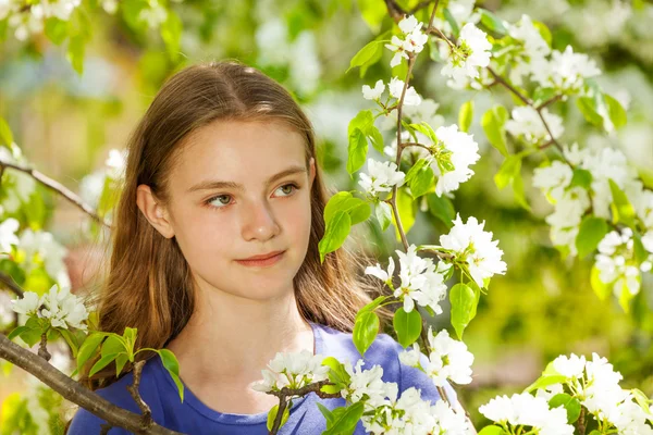 Pretty teenager girl with pear flowers — Stock Photo, Image