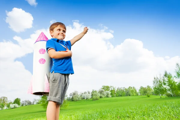 Boy wears paper rocket toy — 스톡 사진