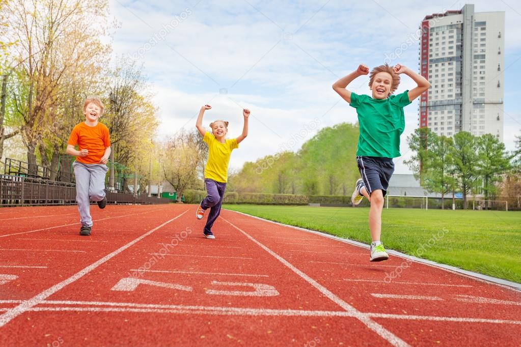 Group of happy kids on stadium