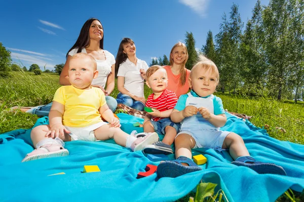 Happy mothers with cute babies — Stock Photo, Image