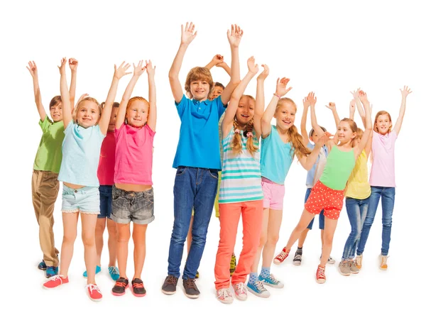 Group of happy kids with raised hands on white — Stock Photo, Image