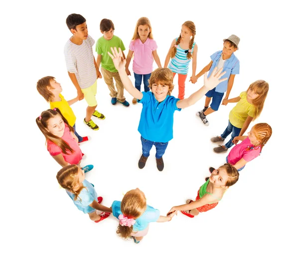 Caucasian boy in circle of friends — Stock Photo, Image