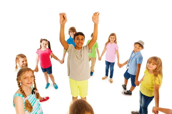 Nice looking boy stand in circle of other kids — Stock Photo, Image