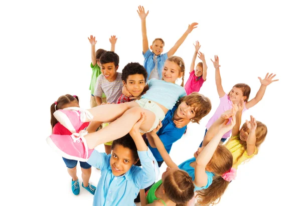 Team celebrating victory and lifting leader — Stock Photo, Image