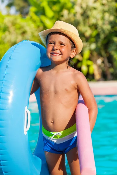 Close-up of boy with inflatable ring, pool noodle — Stock Photo, Image