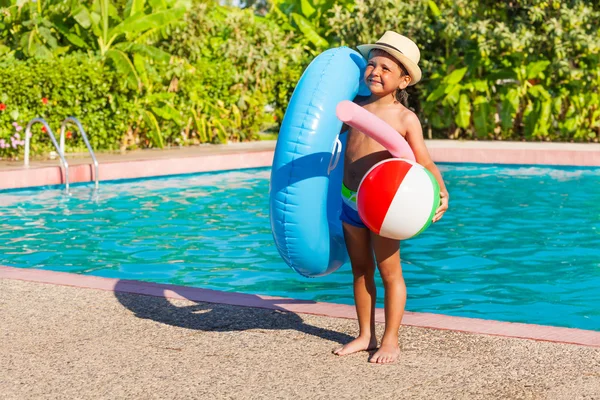 Boy with inflatable ring, ball, pool noodle — Stock Photo, Image