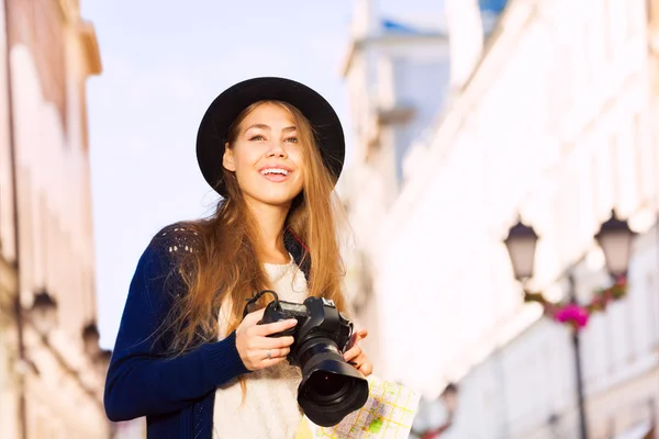 Woman in retro outfit with camera — Stock Photo, Image