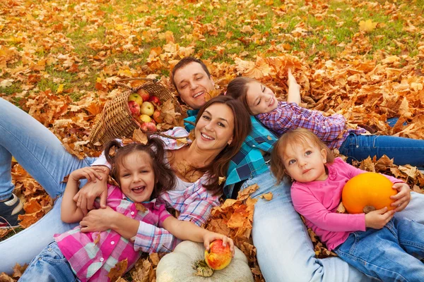 Happy family in the autumn park — Stock Photo, Image