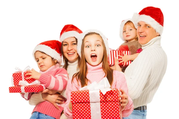 Surprised family with presents — Stock Photo, Image