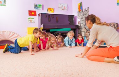 Active game kids and teacher stand on all fours clipart