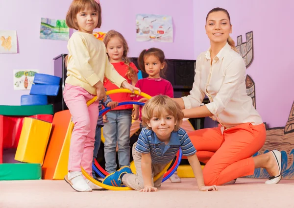 Teacher, kids in kindergarten — Stock Photo, Image