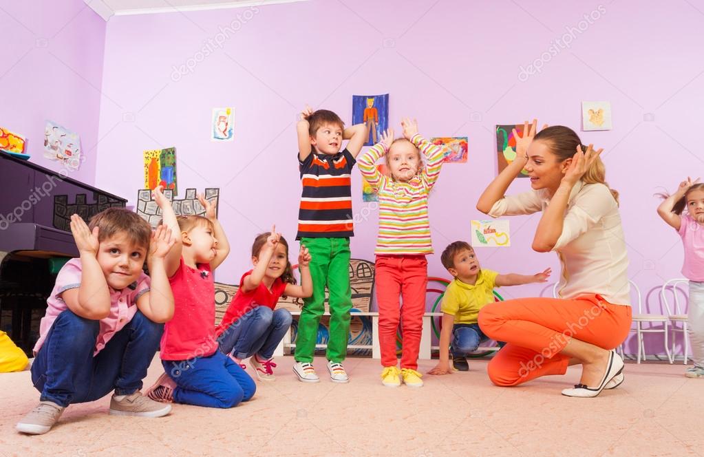 Kids repeat after teacher making ears