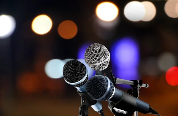 Microphones with blur lights background — Stock Photo, Image