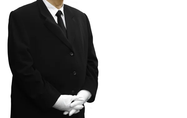 Людина в чорному костюмі стоїть над білим — стокове фото